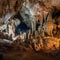 Beautiful mysterious karst cave, stalactites, stalagmites, calcareous outgrowths and scenery,