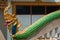  Beautiful Naga statue decorates the railing of the stairs in a temple 