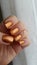 Beautiful Nails with Metallic Copper Nailpolish