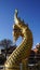 Beautiful Naka sculpture decoration at the staircase of Buddist stupa calls Phrathammachedi in Wat Pothisomphon the landmark of