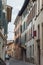 Beautiful narrow alley with many windows in Brescia city