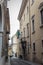 Beautiful narrow alley with many windows in Brescia city