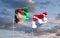 Beautiful national state flags of Singapore and Afghanistan together at the sky background