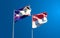 Beautiful national state flags of Singapore and American Samoa together at the sky background