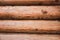 Beautiful Natural background Pattern of a Log Wall. Wooden Log Cabin Wall. Natural Colored Horizontal Background