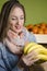 Beautiful natural brunette buying bananas