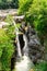 Beautiful natural canyon and amazing waterfall of the mountain river at the rain. Martvili canyon in Georgia