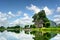 Beautiful natural karst tower reflected in the Ngo River