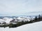 Beautiful natural landscape with mountains and bare trees covered with snow..Ski resort in winter season, Active recreation in the