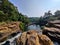 beautiful natural landscape view of waterfall passing through rocks in india