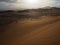 Beautiful natural rusty red sand dune and salt pan of vast desert landscape view with strong sunlight, Sossus, Namib desert