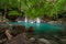 Beautiful natural scenic of Erawan waterfall tier four with emerald green pond named Oak Pee Sua