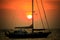 Beautiful natural scenic of sun set behind sailing boat