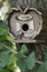 Beautiful natural wooden birdhouse in the garden