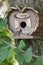 Beautiful natural wooden birdhouse in the garden