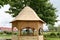 Beautiful natural wooden gazebo for barbecue and outdoor recreation with a roof