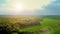 Beautiful nature, aerial drone view on rural countryside landscape, shining sun sunset sky horizon Ver 2