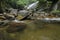 Beautiful in nature, amazing cascading tropical waterfall. wet and mossy rock