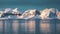 Beautiful nature. Antarctic landscape. Icebergs, glaciers and mountains at sunset. Climate change, global warming