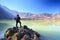 Beautiful nature background with unidentified hiker at Segara Anak Lake. Mount Rinjani is an active volcano in Lombok, indonesia.