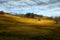 Beautiful nature landscape. Golden tree hills and blue cloudy sky