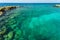 Beautiful nature landscape view. Rocky coast line.  Blue water surface of Atlantic ocean merging with blue sky on Curacao island