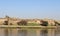 The beautiful nature mix of sandy hills and plants and river in Aswan