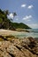 Beautiful nature, tropical beach with clear water and stones. reflection and cloudy blue sky