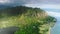 Beautiful nature view of green jungle mountain peaks revealing tropical beach 4K