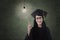 Beautiful nerd in graduation gown have idea