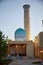 The beautiful new madrasah minaret and the dome of the in Samarkand