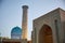 The beautiful new madrasah minaret and the dome of the in Samarkand