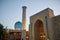 The beautiful new madrasah minaret and the dome of the in Samarkand