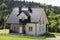 A beautiful newly built house. Yard with green grass.