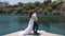 Beautiful newlyweds on the background of a river.