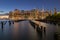 Beautiful Night Light and Lower Manhattan skyline with East River and New York City. Twilight with Reflections and Abandoned Pier