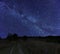 Beautiful night rural landscape with starry sky and Milky Way galaxy
