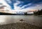 Beautiful night scene from shoreline of lake with mountain on fa