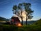 Beautiful night scene startrails with a family camping with a car and a tent and camp fire in the wild Apuseni mountains, Transylv