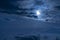 Beautiful night sky. The full moon illuminates clouds. Nature background.