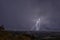 Beautiful night sky with lightning and thunderbolts during a thunderstorm in the countryside