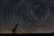 Beautiful night sky, Star trails over filed and astronomical telescope