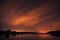 Beautiful night sky with stars, clouds and reflections in the wa