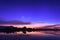 Beautiful night sky with stars, clouds and reflections in the wa