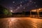 beautiful night sky with stars and the moon, and outdoor dance floor in the foreground