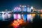 Beautiful night view of a colorful cruise ship traveling on River