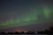 beautiful night view of houses under sky with majestic northern lights