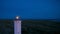 Beautiful nightly seascape with lighthouse and moody sky at the sunset