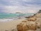 Beautiful Nissi beach with rolling sea with waves on a cloudy murky day in Ayia Napa, Cyprus