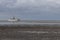 Beautiful North Sea coast of Cuxhaven in Germany. Overcast sky with clouds over the sea at low tide